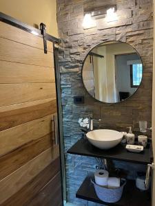 a bathroom with a sink and a mirror at Posada Patagonica in Trevelin