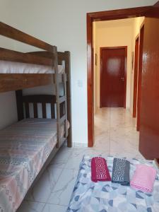 Ένα ή περισσότερα κρεβάτια σε δωμάτιο στο Quarto & Conforto