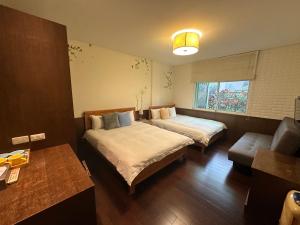 Giường trong phòng chung tại Siangting B&B