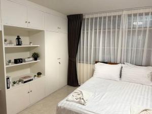 เตียงในห้องที่ 10MIN 曼谷独栋Chatuchack,Kasetsart精品别墅 MYSTORY HOUSE
