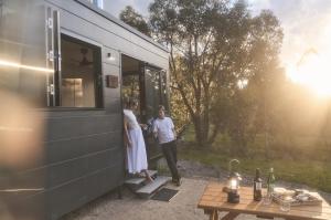 a man and woman standing outside of a trailer at CABN Hahndorf in Hahndorf