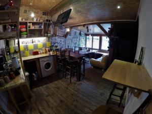 a kitchen and dining room with a table and chairs at Hikers Hostel in Plovdiv