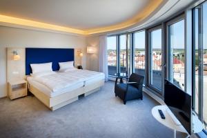 Posteľ alebo postele v izbe v ubytovaní Hotel Erwin Junker