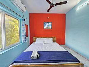 Ένα ή περισσότερα κρεβάτια σε δωμάτιο στο Wom Auro Galaxy