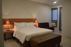 Postel nebo postele na pokoji v ubytování Mango Suites - Isabela