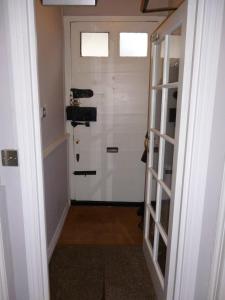 a hallway with a door with a window and a door at Kings House Wokingham in Wokingham