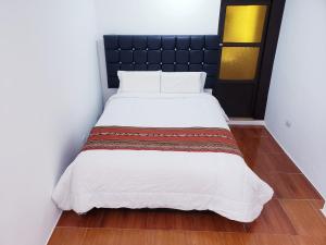 Letto o letti in una camera di Hostal Cusco de mis Sueños