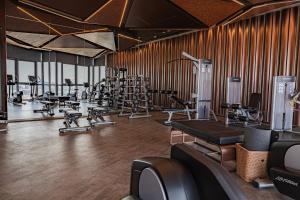 a gym with treadmills and exercise equipment in it at Luxury Condo Edge Central Pattaya in Pattaya Central