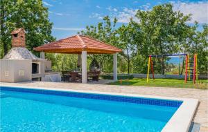 a pool with a gazebo and a playground at Five-Bedroom Holiday Home In Blato Na Cetini in Blato na Cetini +34 photos
