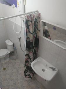 a bathroom with a sink and a shower curtain at Travellers Rest in Ko Chang +33 photos