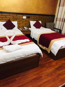 Postel nebo postele na pokoji v ubytování Hotel Bagmati + 37 fotografií