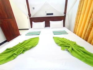 Postel nebo postele na pokoji v ubytování Amal Guest house