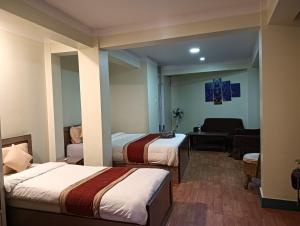 Hotel Pristine客房内的一张或多张床位