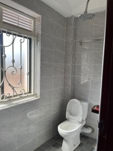 Koupelna v ubytování Ingrid's Place - Namugongo + 4 fotografie