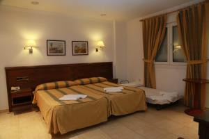 Postel nebo postele na pokoji v ubytování Hotel Tio Felipe