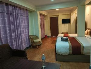Hotel Pristine客房内的一张或多张床位