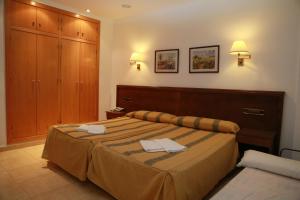 Ένα ή περισσότερα κρεβάτια σε δωμάτιο στο Hotel Tio Felipe