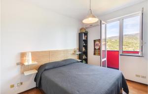 A bed or beds in a room at Stunning Home In Celle Ligure Sv,