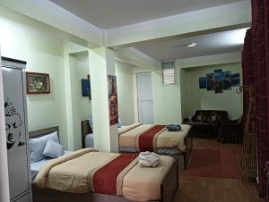 Hotel Pristine客房内的一张或多张床位