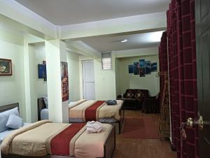 Hotel Pristine客房内的一张或多张床位