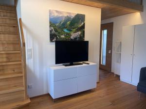 TV a/nebo společenská místnost v ubytování Davenna Loft