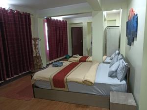 Hotel Pristine客房内的一张或多张床位