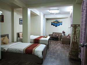 Hotel Pristine客房内的一张或多张床位