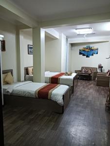 Hotel Pristine客房内的一张或多张床位