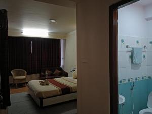 Hotel Pristine客房内的一张或多张床位