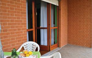 a table with a bowl of fruit on a patio at Le Rocche 1 in Cisterna dʼAsti