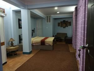 Hotel Pristine客房内的一张或多张床位