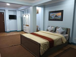 Postel nebo postele na pokoji v ubytování Hotel Pristine