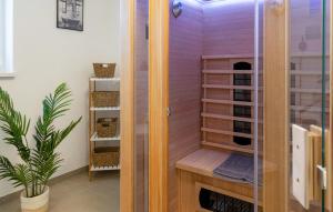 a sauna with a glass door in a room at Gebirgsresort Winterberg in Winterberg