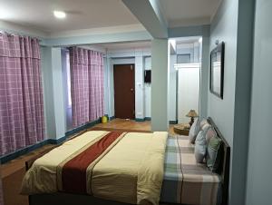 Hotel Pristine客房内的一张或多张床位