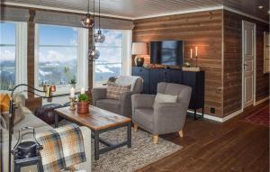 a living room with a couch and chairs and a tv at Pet Friendly Home In Gol With Sauna in Gol