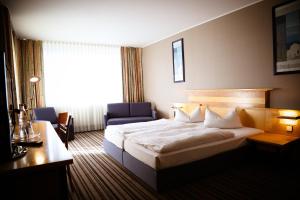 Ένα ή περισσότερα κρεβάτια σε δωμάτιο στο Rheinhessen Inn GmbH +36 φωτογραφίες