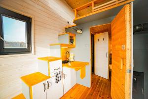 a tiny kitchen in a tiny house at Tiny House Pod Třešní in Kaznějov