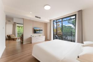 Voodi või voodid majutusasutuse Guilin Camphor Country House -Free pick up service toas