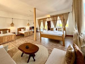 Postel nebo postele na pokoji v ubytování Shirley Residence Kiwengwa