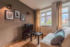 TV a/nebo společenská místnost v ubytování Duplex en cave voutée au coeur de Douai