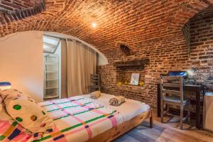 Postel nebo postele na pokoji v ubytování Duplex en cave voutée au coeur de Douai
