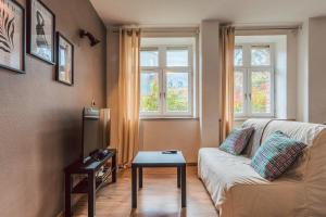 TV a/nebo společenská místnost v ubytování Duplex en cave voutée au coeur de Douai