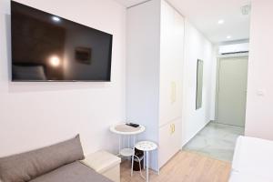Televiisor ja/või meelelahutuskeskus majutusasutuses Luxury Rooms Pojta