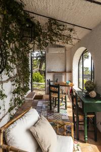 a living room with a couch and a table at Villa Giggione in Erchie