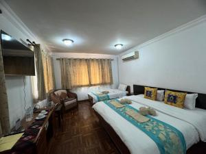 Letto o letti in una camera di Sherpa Home Hotel