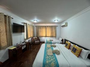 Letto o letti in una camera di Sherpa Home Hotel