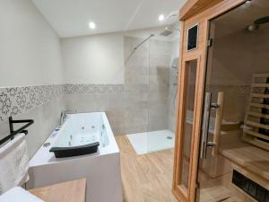 a white bathroom with a sink and a shower at Le Bohème, sauna & spa in Riorges +16 photos
