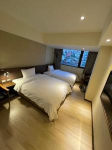 Ein Bett oder Betten in einem Zimmer der Unterkunft Just live inn - New Dahua