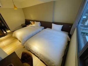 Ein Bett oder Betten in einem Zimmer der Unterkunft Just live inn - New Dahua