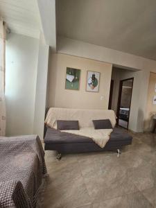 Et opholdsområde på Apto Confortável com 2 quartos em Batista Campos